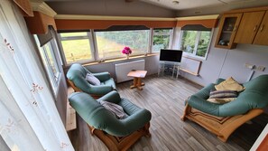 Comfort Mobile Home, 2 Bedrooms, Hill View, Mountainside | Living room | Flat-screen TV - Hawthorn Cottages B&B (Oban)