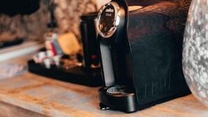 A kitchen counter with a coffee maker and a toaster.