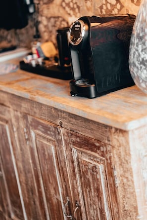 A kitchen counter with a coffee maker and a toaster.