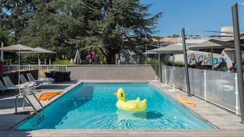 Outdoor pool, open 9:00 AM to 8:00 PM, pool loungers