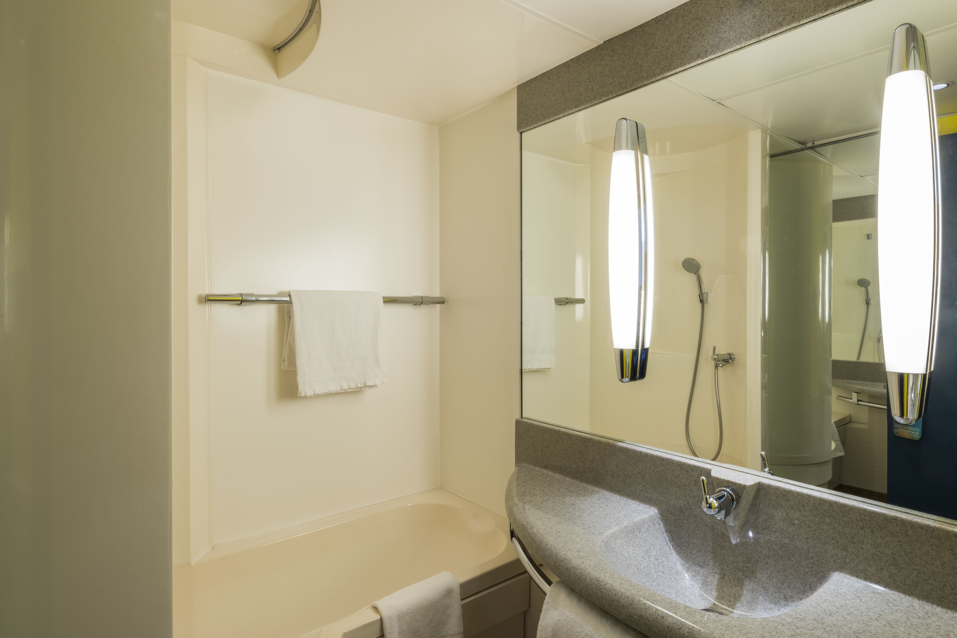 eco-friendly toiletries, hair dryer, towels