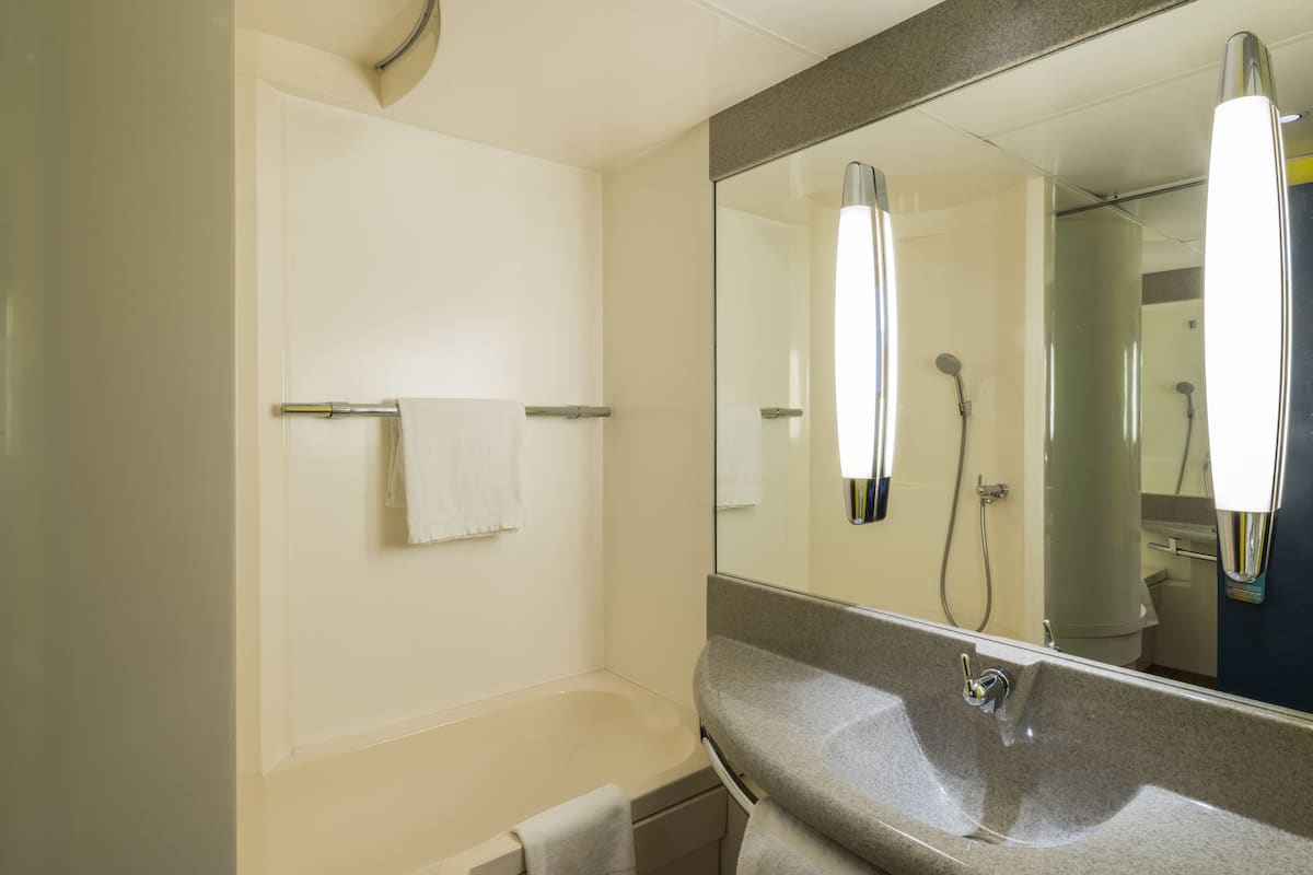 eco-friendly toiletries, hair dryer, towels