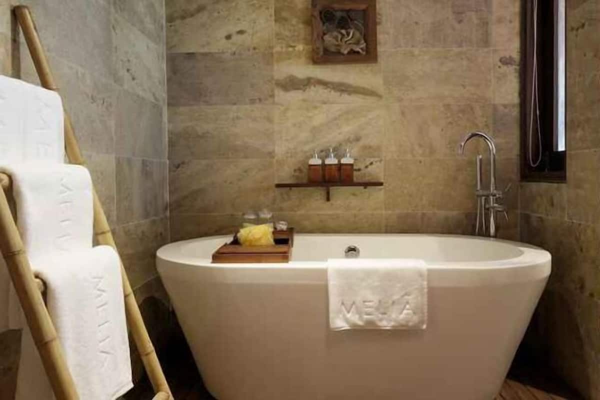 Bathroom | Rainfall showerhead, eco-friendly toiletries, hair dryer, bathrobes