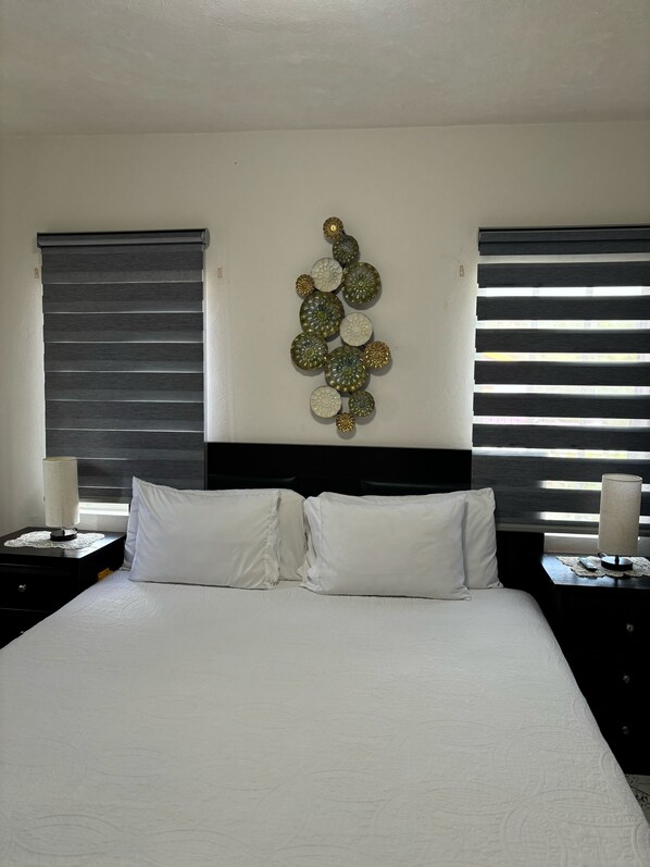 Apartment, 1 King Bed | 1 bedroom, desk, blackout curtains, iron/ironing board