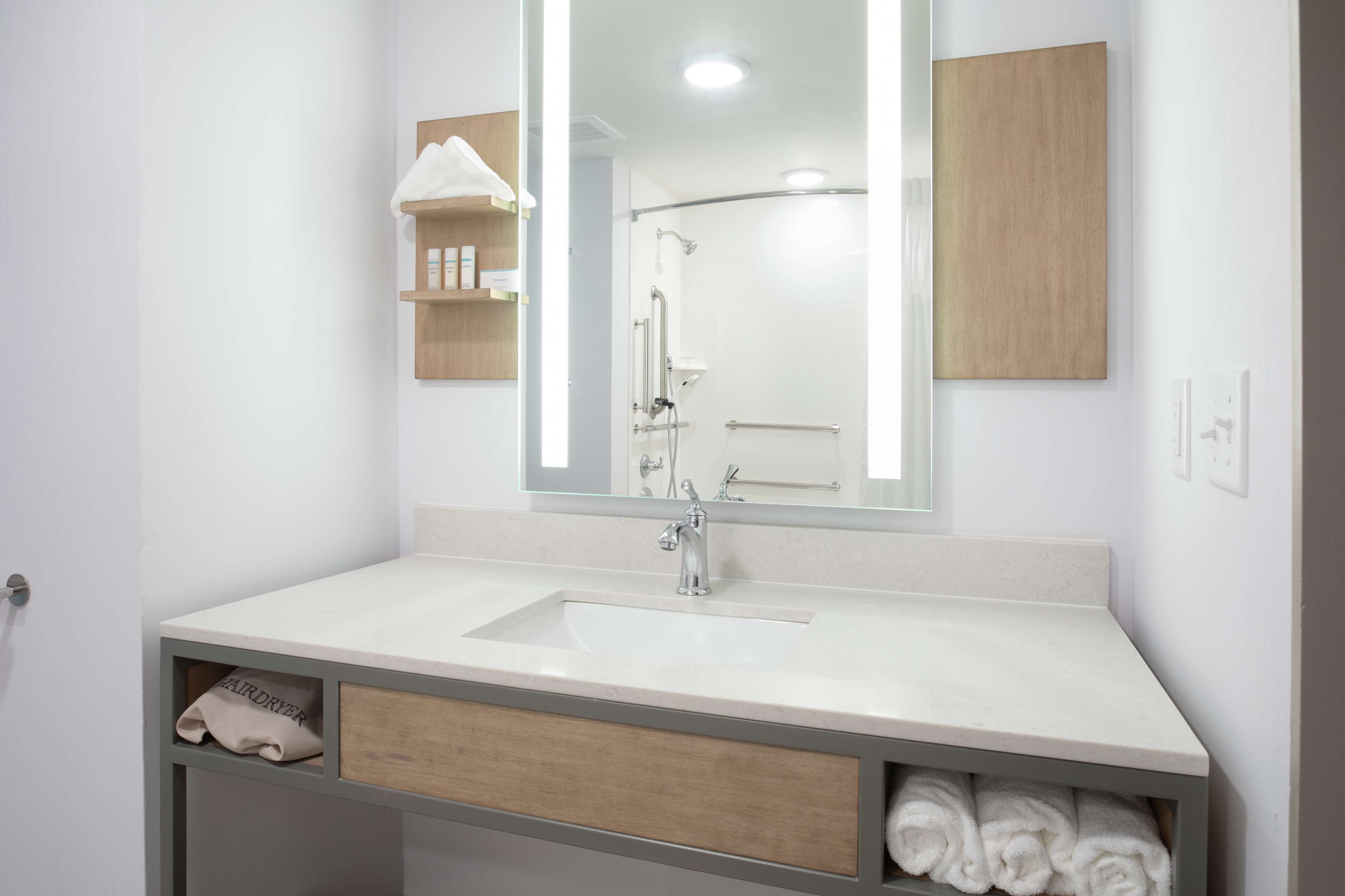 hydromassage showerhead, designer toiletries, towels