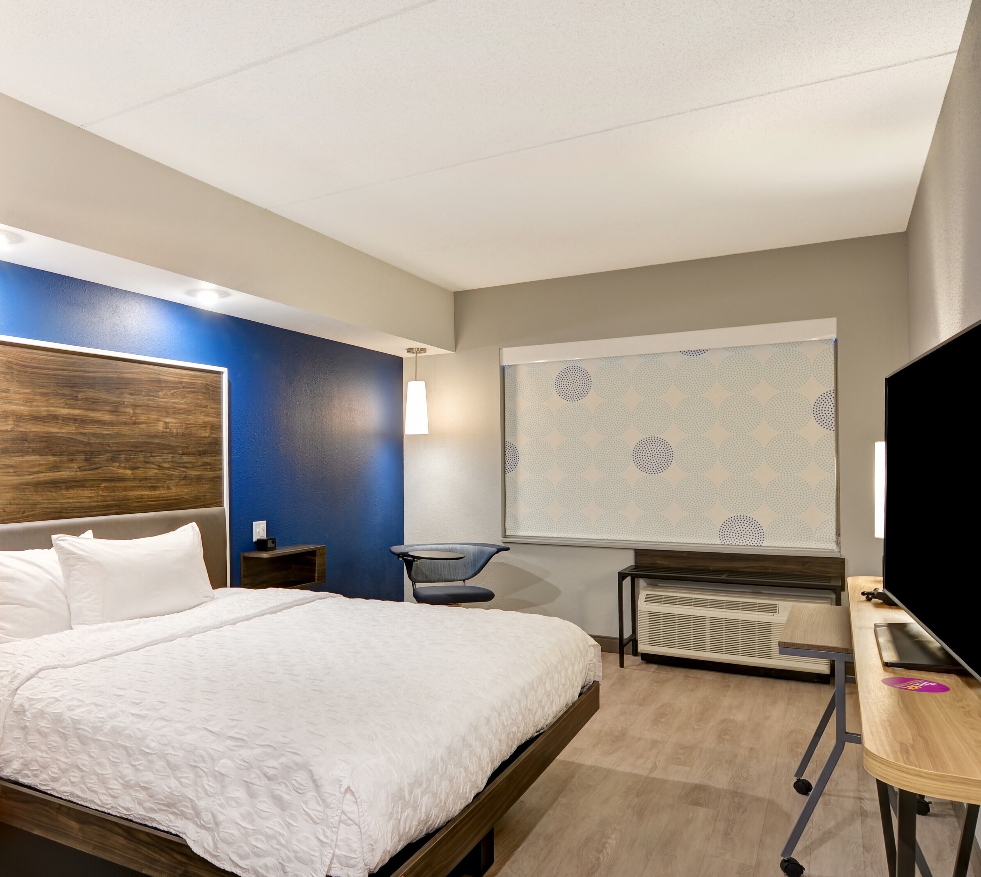 premium bedding, laptop workspace, blackout curtains, iron/ironing board