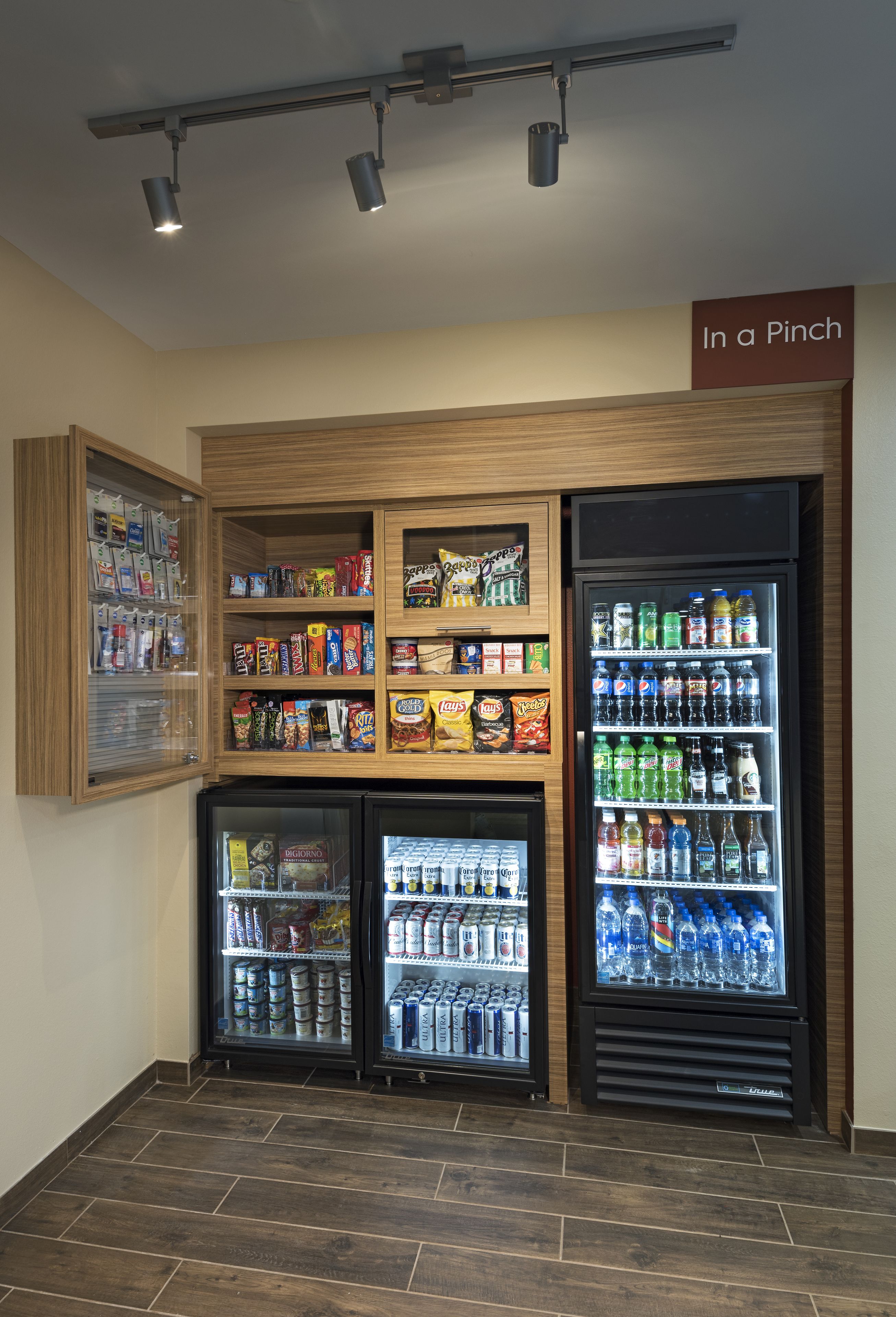 A vending area with snack and drink options, including a refrigerated section and a freezer.