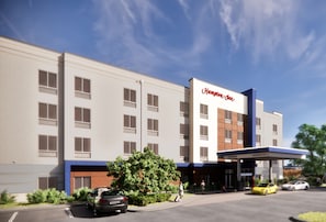 A Hampton Inn hotel with a modern facade, multiple windows, and a gas station entrance. - Hampton Inn Nashville Airport Century Place, TN (Nashville)