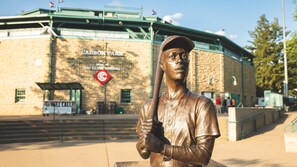 A bronze statue of a baseball player in front of a building with "CARSON PARK" and "HOME OF EAU CLAIRE BASEBALL" signs. - Candlewood Suites Eau Claire I-94 by IHG (Eau Claire)