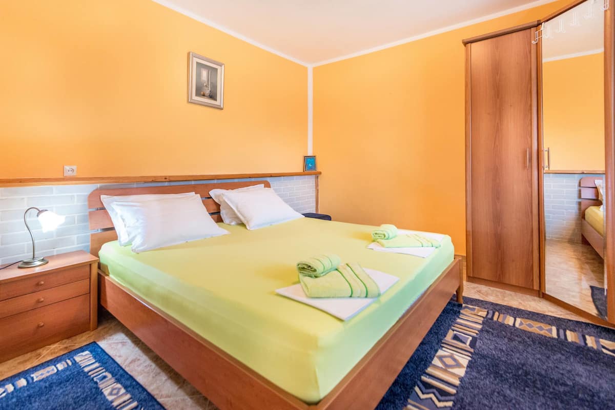 Apartment, 1 Bedroom, Ground Floor | 1 bedroom, desk, soundproofing, iron/ironing board