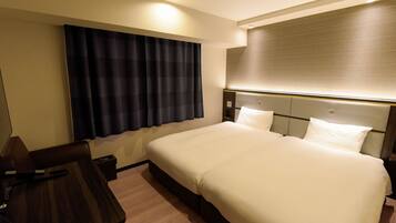 Down comforters, desk, blackout drapes, iron/ironing board