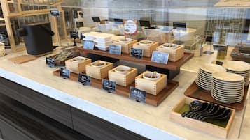 A display of various food items and utensils in a store.