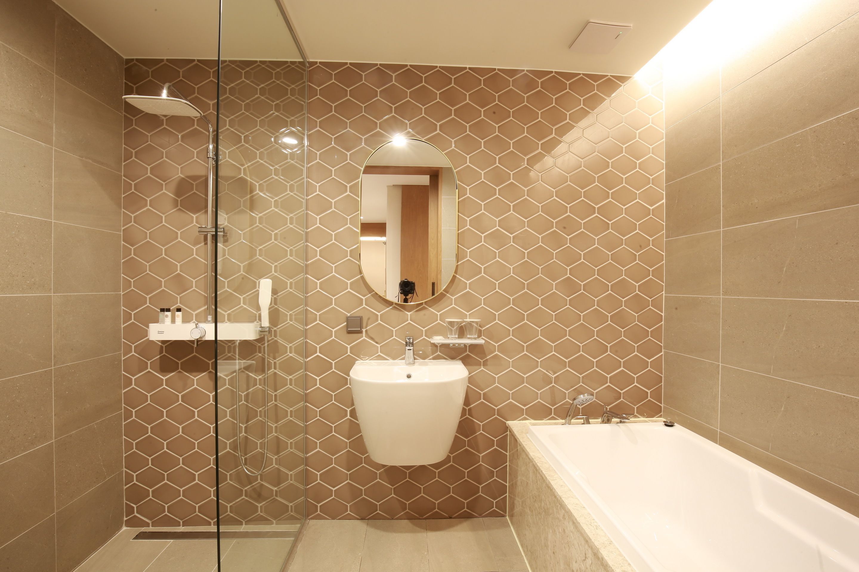 deluxe family room | bathroom | hair dryer, bathrobes, slippers, bidet