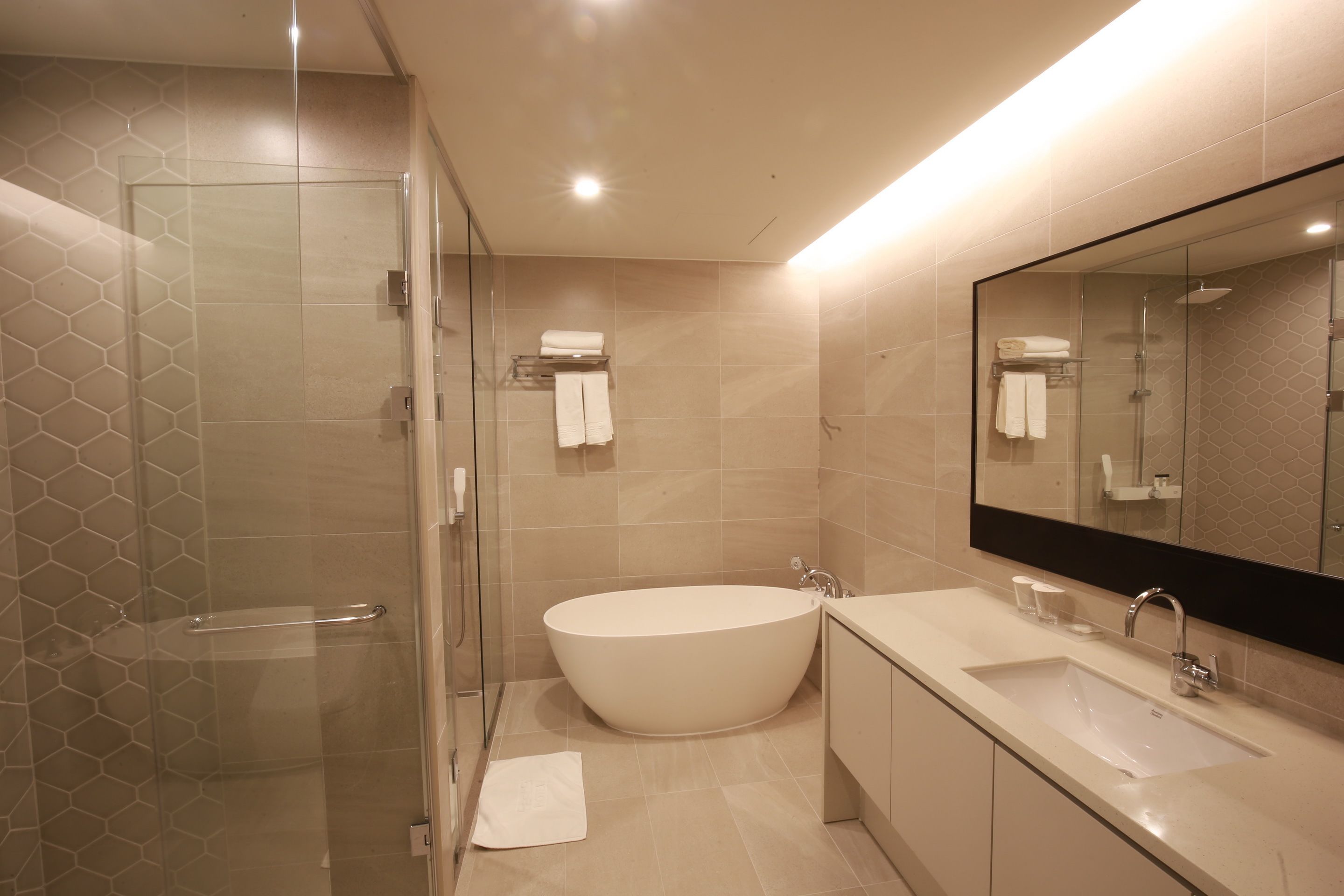 deluxe family room | bathroom | hair dryer, bathrobes, slippers, bidet