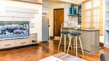 2 BHK Deluxe Apartment City View | Living area | 49-inch LED TV with satellite channels, TV, pay movies