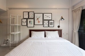 Standaard kamer | Verduisterende gordijnen, een strijkplank/strijkijzer