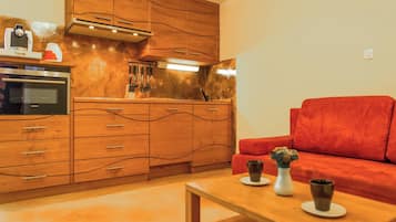 Apartment, 1 Bedroom, Ground Floor | Living area | Flat-screen TV