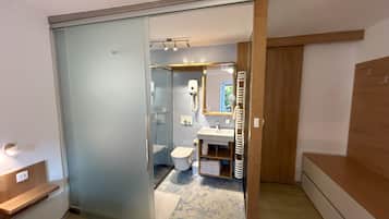 Apartment, 2 Bedrooms, Ground Floor | Bathroom | Shower, deep-soaking bathtub, hair dryer, towels