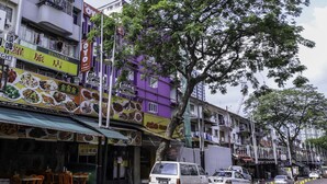 A street view with a restaurant named 'OYO' and another with 'Carlsberg' signage.