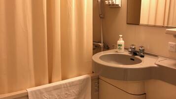 Combined shower/tub, free toiletries, hair dryer, slippers