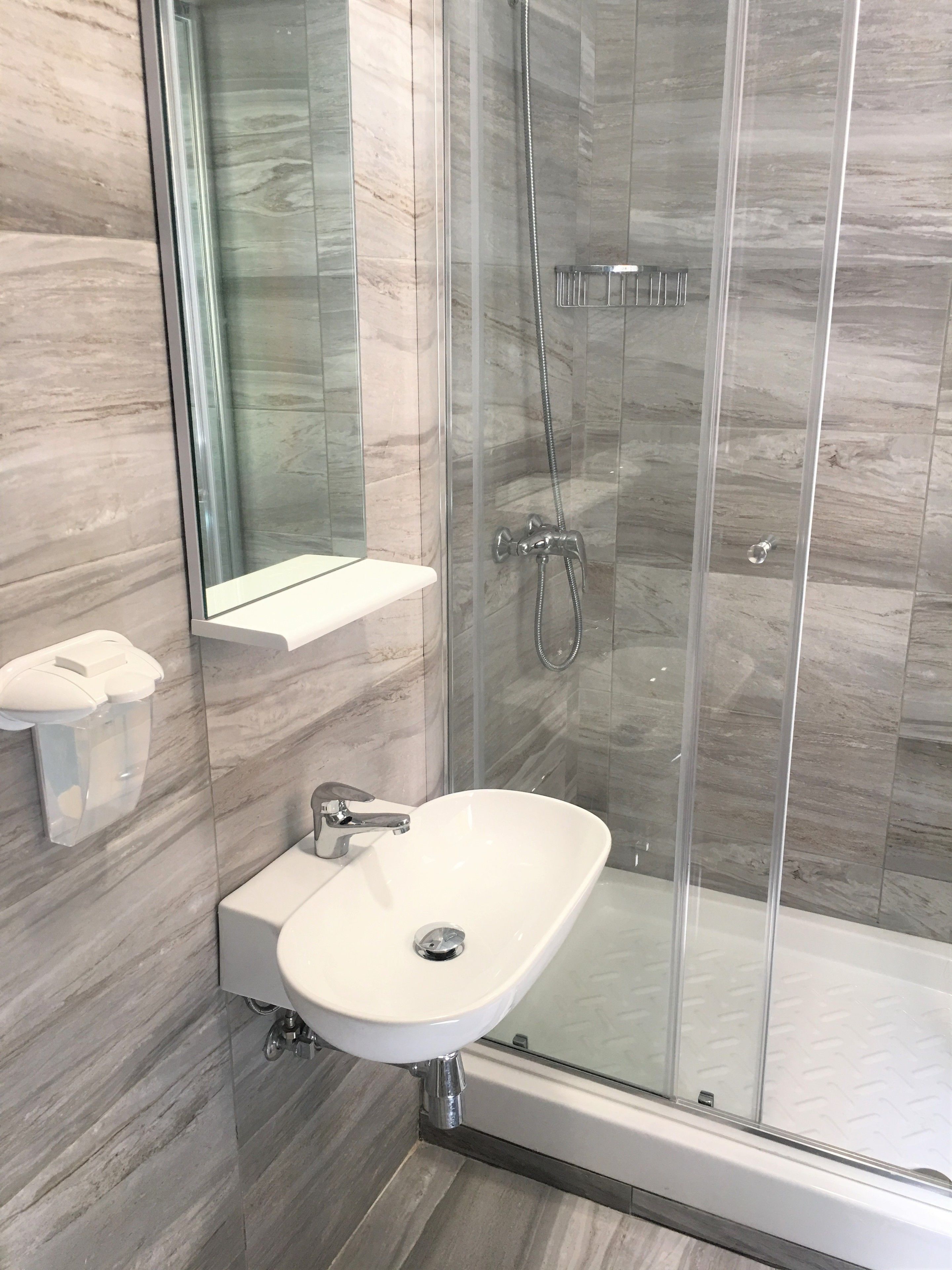 Shower, deep-soaking bathtub, free toiletries, hair dryer