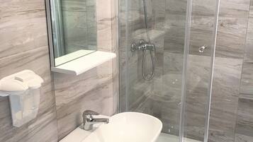 Shower, deep-soaking bathtub, free toiletries, hair dryer