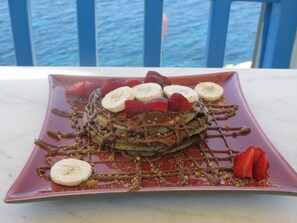 Savor a sweet treat on our balcony overlooking the view.