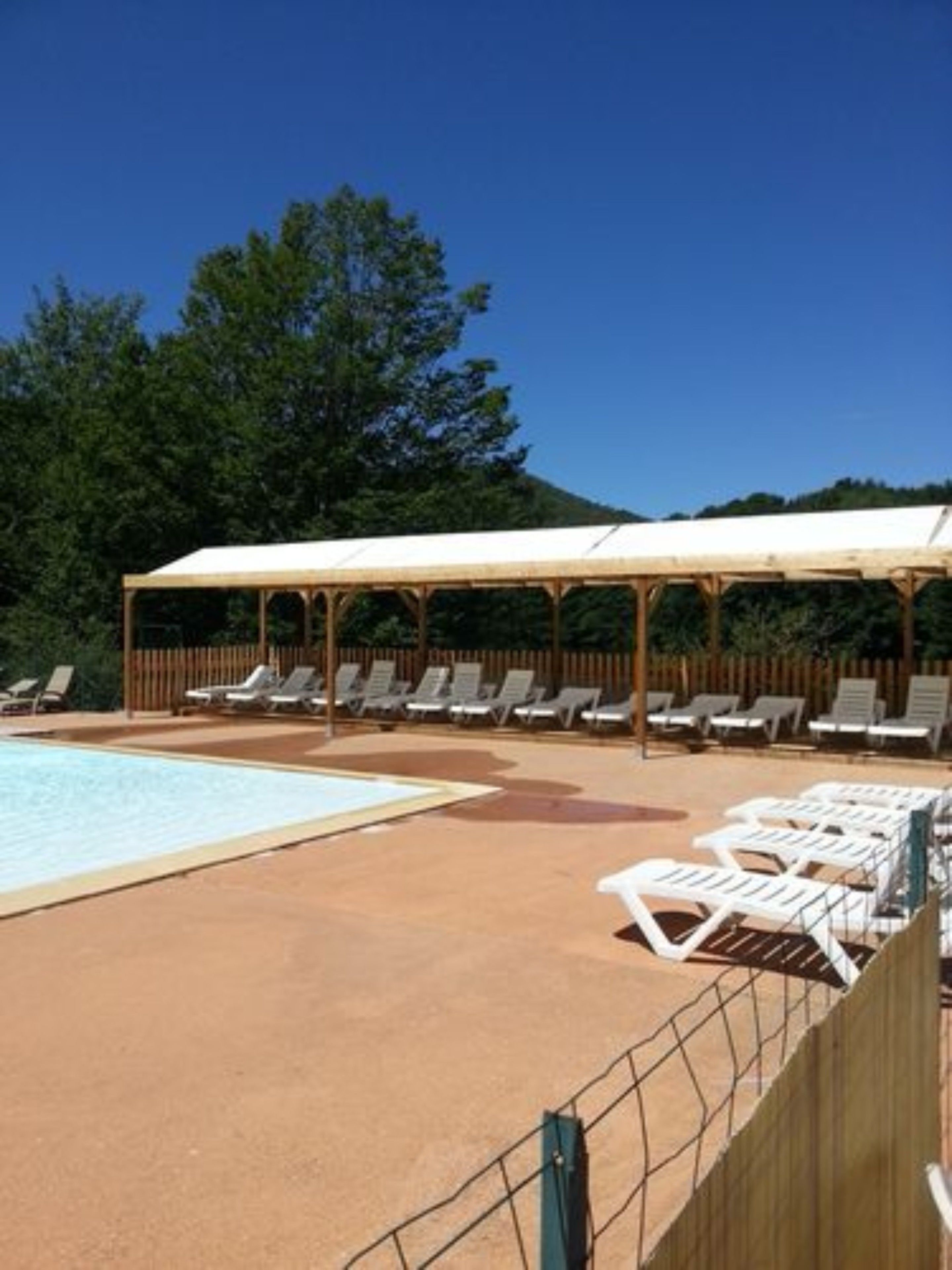 Seasonal outdoor pool, open 10:30 AM to 8 PM, pool umbrellas