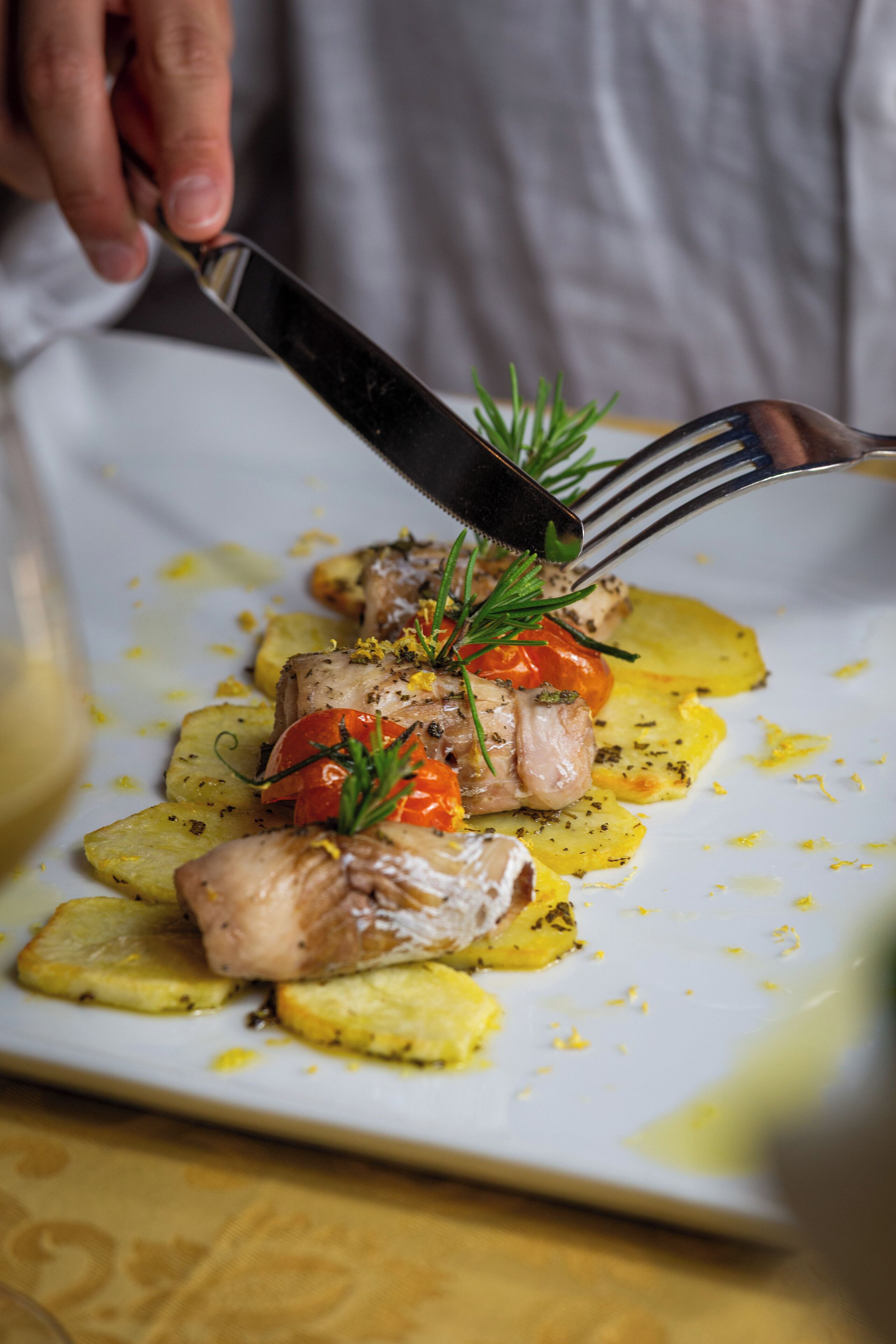 A plate of food with a fork and knife.