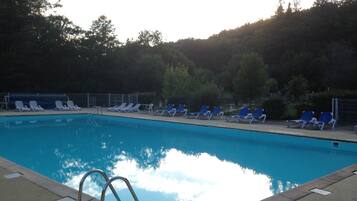 Seasonal outdoor pool, a heated pool, sun loungers