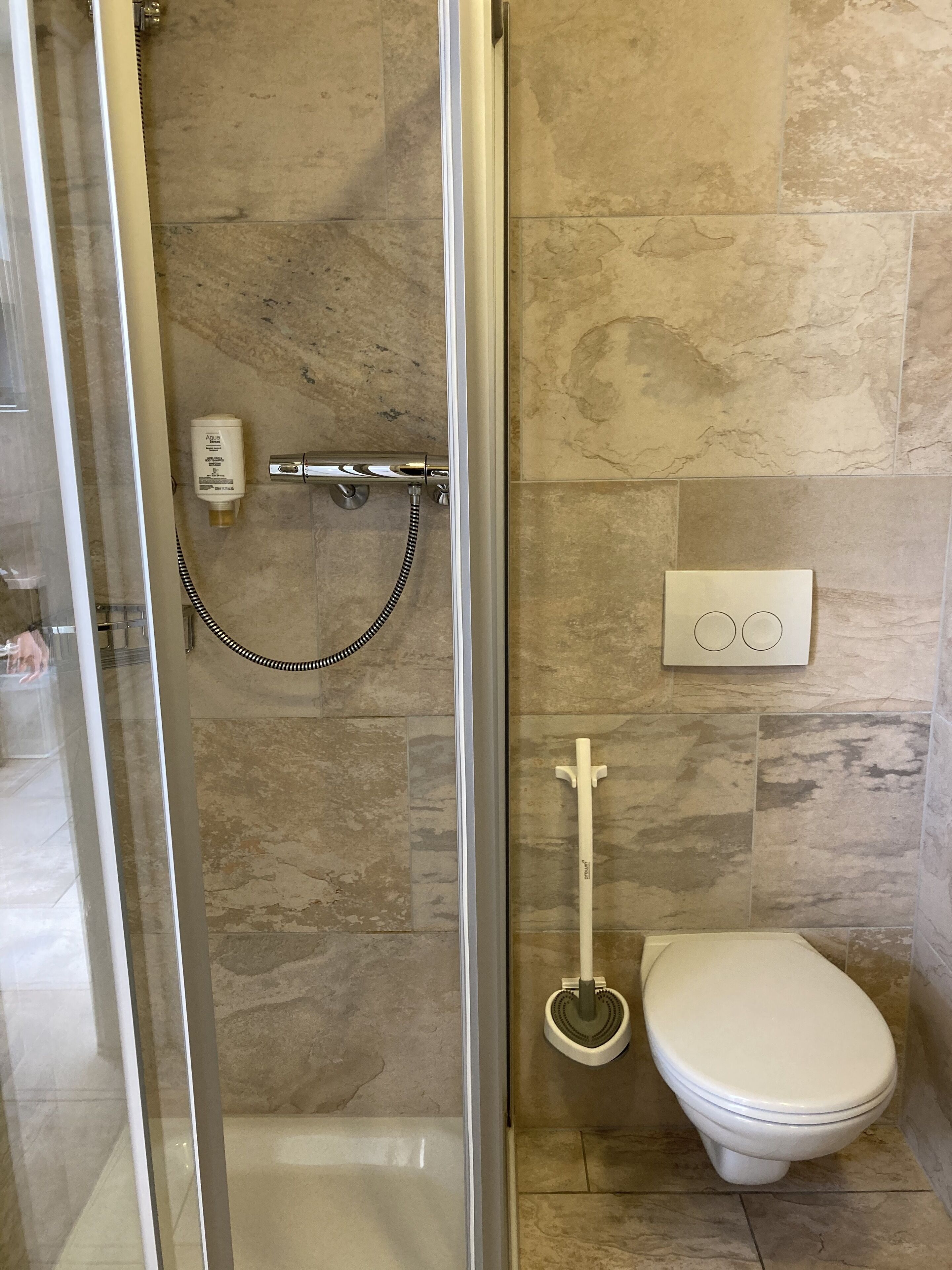 standard single room | bathroom | shower, free toiletries, hair dryer, towels