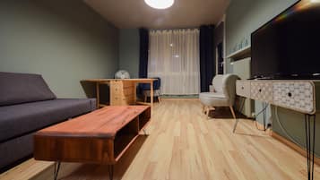 Classic Apartment, 1 Bedroom, Balcony | Living area | Flat-screen TV