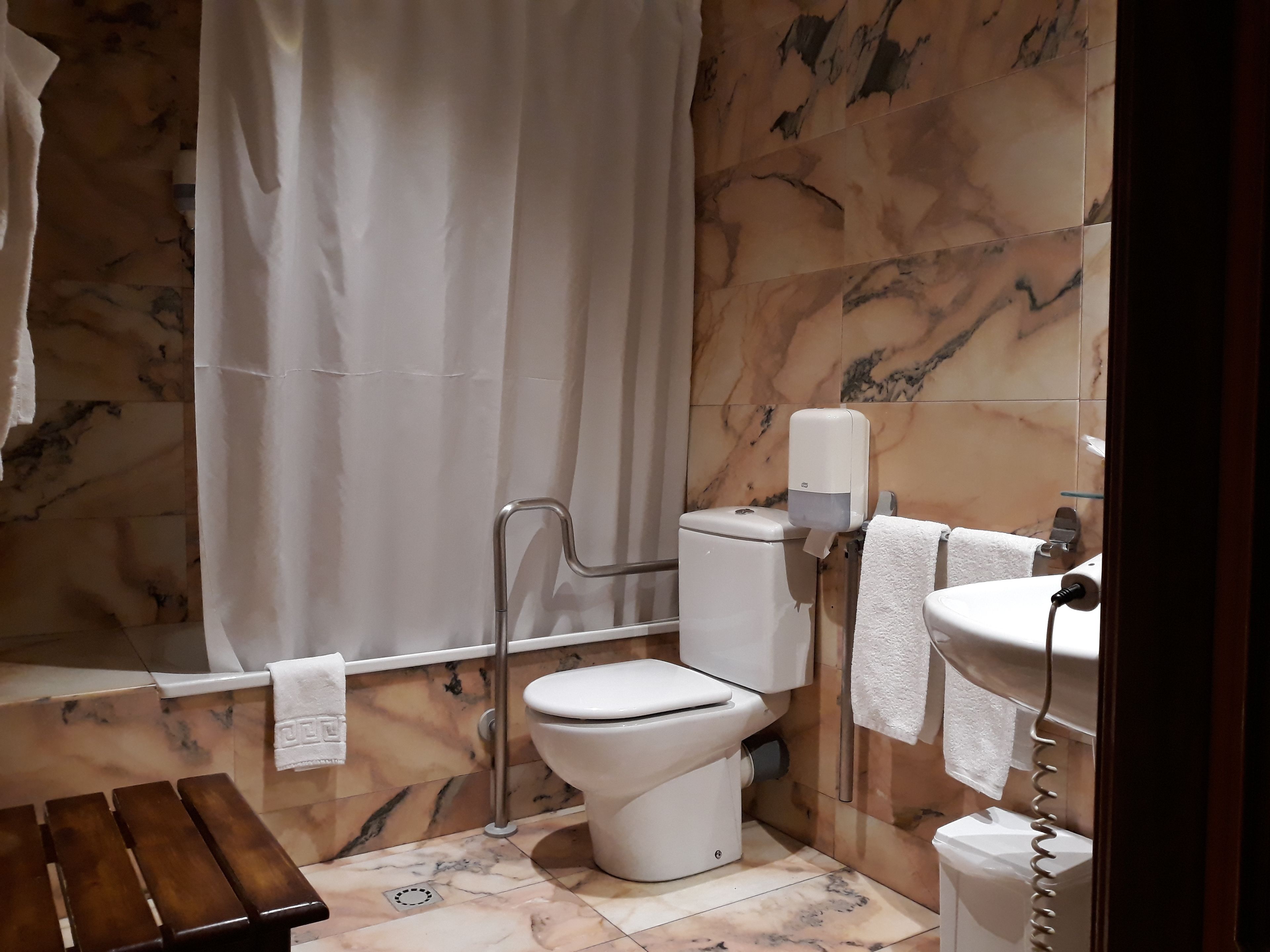 bathtub, free toiletries, hair dryer, towels