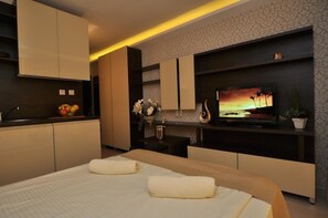 Standard Studio | Living area | 0-inch flat-screen TV with satellite channels, TV - Harmony Suites 2 & 3 (Sunny Beach)