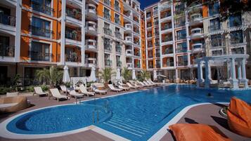 Seasonal outdoor pool, pool umbrellas, pool loungers