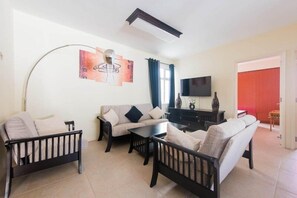Apartment, 2 Bedrooms | Living room | Flat-screen TV