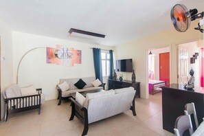 Apartment, 2 Bedrooms | Living room | Flat-screen TV