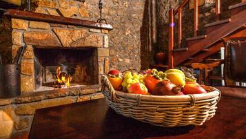 Deluxe Suite, Jetted Tub | Living area | 32-inch LCD TV with digital channels, TV