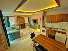 Deluxe Condo, 1 Bedroom | Living area | LCD TV