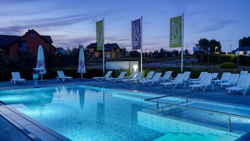 Seasonal outdoor pool, open 10:00 AM to 8:00 PM, pool umbrellas