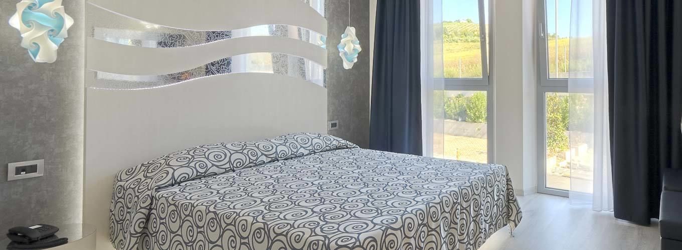 double or twin room | in-room safe, desk, laptop workspace, blackout curtains