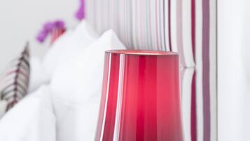 A red cylindrical object, possibly a vase, in the foreground.
