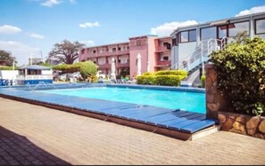 Outdoor pool, pool umbrellas, sun loungers