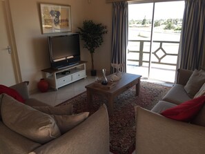 Deluxe Apartment, Garden View, Annex Building | Living room | Flat-screen TV - Oceanview Suite (Swakopmund)