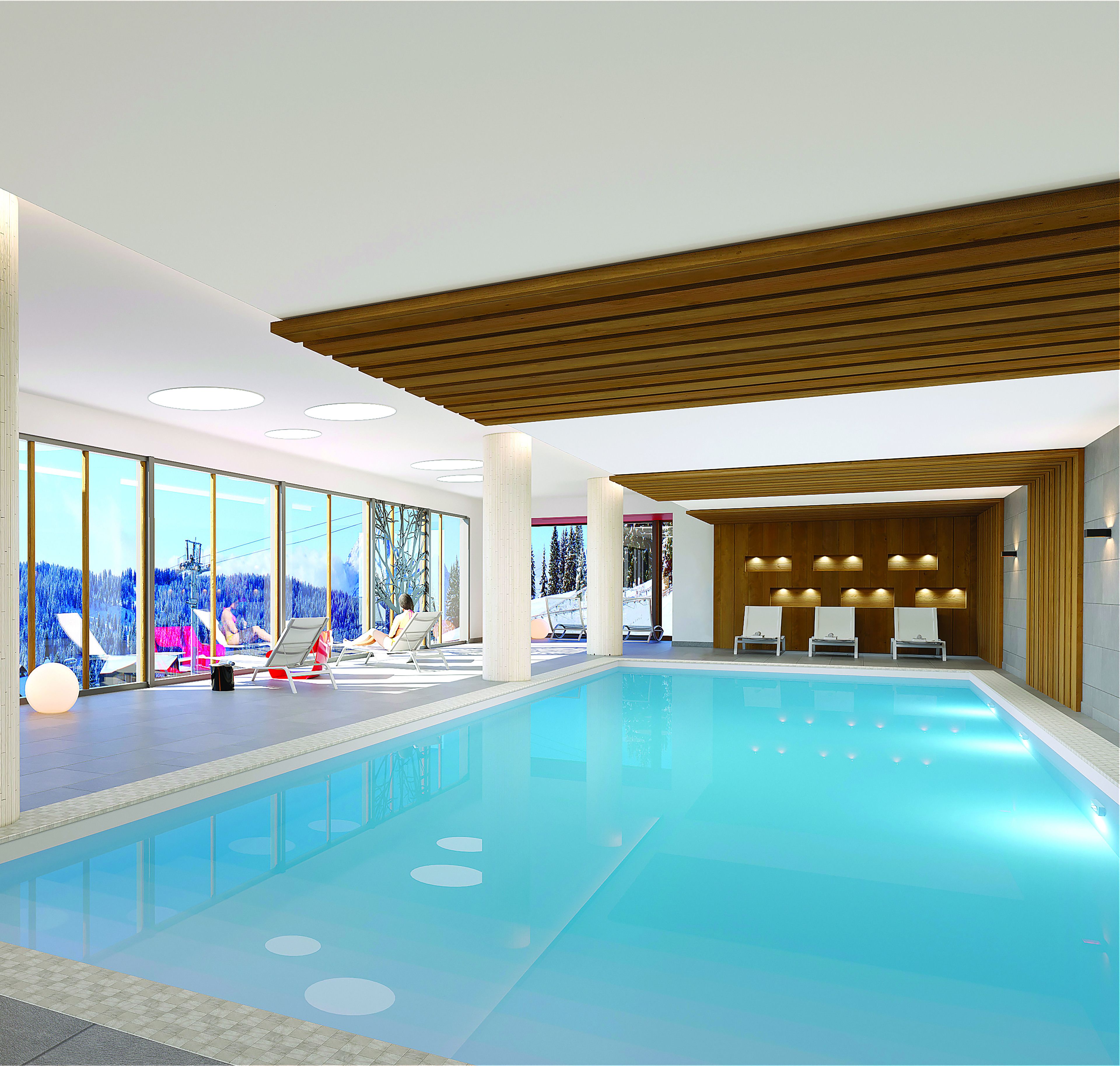 A modern indoor swimming pool with clear glass walls, lounge chairs, and a wooden ceiling.