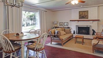 Cottage, 3 Bedrooms, Beachfront | Living room | Flat-screen TV, fireplace