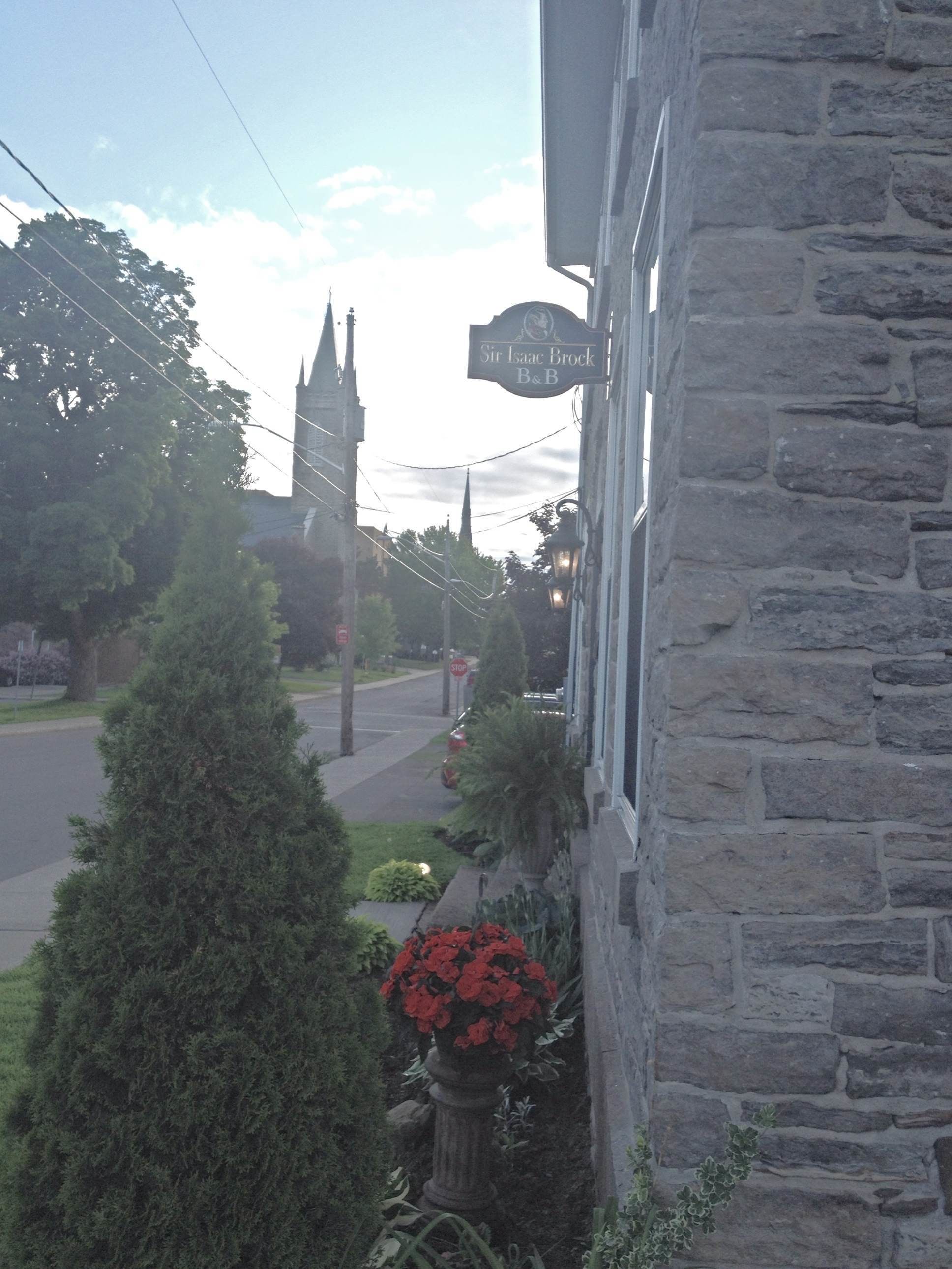 A stone building with a sign reading "Sir Isaac Brock B&B".