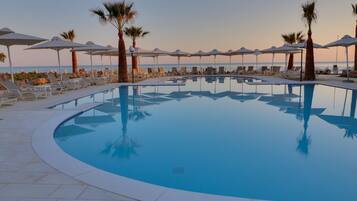 Seasonal outdoor pool, pool umbrellas, pool loungers