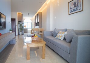 Premium Suite, 2 Bedrooms, Park View | Living room | 32-inch flat-screen TV with cable channels, TV