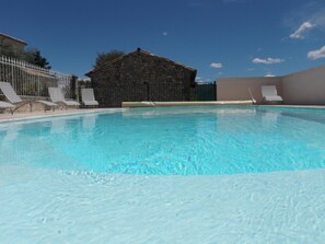 Seasonal outdoor pool, pool umbrellas, pool loungers